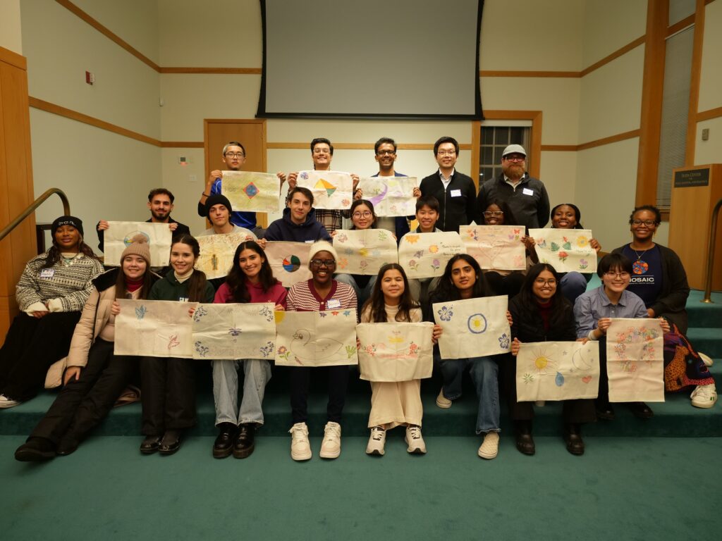 SOKA University students holding up their peace flags after participating in a Mosaic Dialogue Session